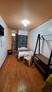 a bedroom with a bed and a treadmill in it at Hab simplex in Cajamarca
