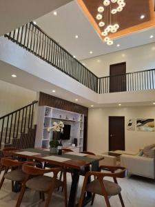 a dining room with a table and some chairs at Casa Marangle Private Villa in Mexico