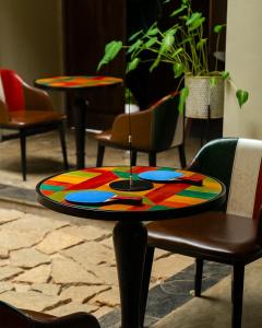 a colorful table sitting on a table in a room at Willow Resorts Wayanad in Ambalavayal +19 photos