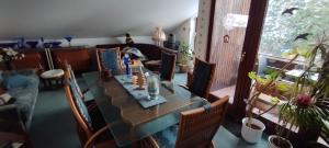a living room with a table and chairs and a couch at Steffi in Hannover
