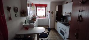 a kitchen with a table and chairs in a room at Steffi in Hannover