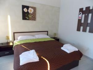 A bed or beds in a room at Apart Hotel Rosen