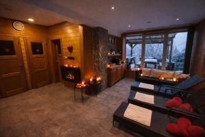 a living room with a fireplace in a house at Chalupa Štikov v Podkrkonoší in Nová Paka +37 photos