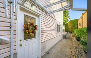 a door to a house with a wreath on it at Spacious 2 Bedroom Suite in Delta