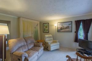 a living room with a couch and a chair at Higgin's Inn in Powell River