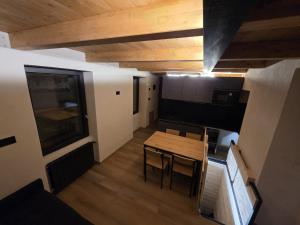 an overhead view of a room with a table and chairs at Muranche Lofts N1 in Valtournenche