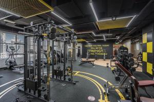 a gym with lots of exercise equipment and a sign at Downtown Dubai Mall walk & Burj Khalifa DIFC 5 mins in Dubai