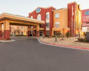 an empty parking lot in front of a building at Comfort Suites Tulsa Central in Tulsa