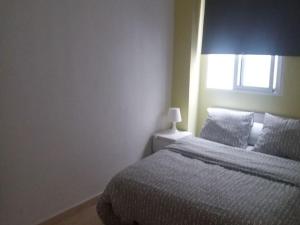 Posteľ alebo postele v izbe v ubytovaní Apartamento Ciudad de las Ciencias