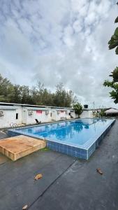 a large swimming pool on top of a building at D’Razna Inn in Kuala Terengganu