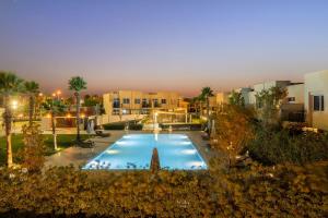 an overhead view of a swimming pool at a hotel at FIRST CLASS Villa Peaceful Pool View Retreat in Dubai