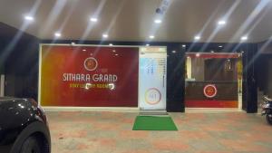 a display of a stand in a room with a car at Sithara Grand in Ongole