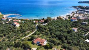 an aerial view of a resort next to the ocean at Dora Apartments in Tragaki