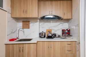 a kitchen with a sink and a counter top at Tritara Apartment in Kathmandu +14 photos