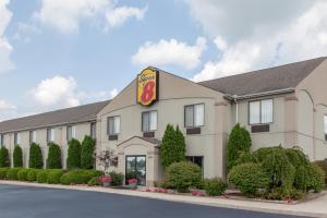 a hotel with a sign on the front of it at Super 8 by Wyndham Goshen in Goshen