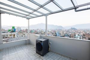 a balcony with a view of a city at Tritara Apartment in Kathmandu