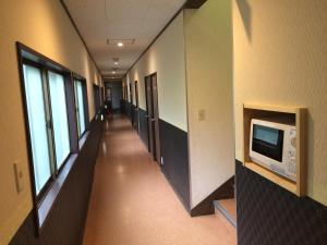TV a/nebo společenská místnost v ubytování Hotel Famitic Myojin