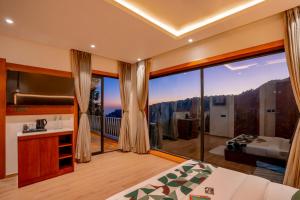 a bedroom with a large window with a view at Moustache Select Nainital- Onsite Parking in Nainital