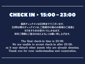 a sign with the words check in and a line at Guest House Umikaji in Naha