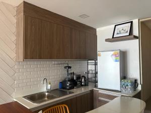 a kitchen with a sink and a counter top at Noahs Ark Beachfront in Lamai