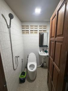 a small bathroom with a toilet and a sink at Noahs Ark Beachfront in Lamai