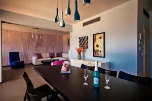 a dining room with a table with wine glasses on it at Centrally located in Gaios