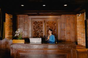 a picture of a woman on a wooden wall at Sand Sea Resort Railay Beach in Railay Beach +146 photos