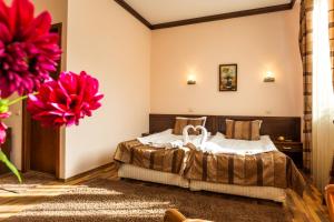 Postel nebo postele na pokoji v ubytování Family Hotel Teteven