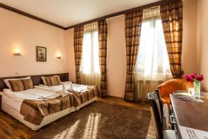 Postel nebo postele na pokoji v ubytování Family Hotel Teteven