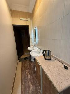 a bathroom with a sink and a toilet at مساكن المبيت 5 new in Abha