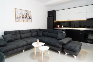 a living room with a couch and a table at Greca Apartments in Sauk