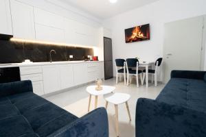 a living room with a couch and a table at Greca Apartments in Sauk