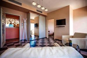a bedroom with a bed and a checkered floor at Centrally located in Gaios