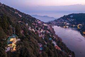 an aerial view of a town on a hill next to a river at Moustache Select Nainital- Onsite Parking in Nainital +56 photos