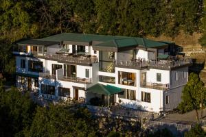 an aerial view of a building with a green roof at Moustache Select Nainital- Onsite Parking in Nainital