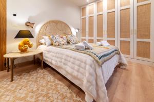 a bedroom with a large bed and a table at Cangas de Onís CENTRO in Cangas de Onís