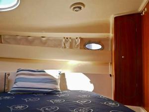 a bed in the back of a boat at Palermo Boat Experience in Isola delle Femmine