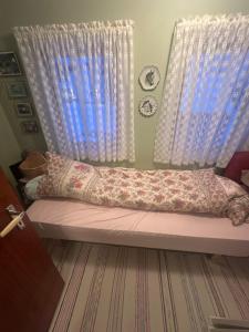 a bed in a room with a window at Holiday home for rent in Lyngen