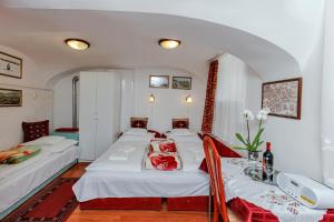 Postel nebo postele na pokoji v ubytování Barokk Vendégház