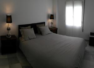 เตียงในห้องที่ Apartamento Almirante Hoyos IV