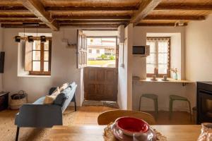 a living room with a couch and a table at El rinconin del Sueve in San Martín