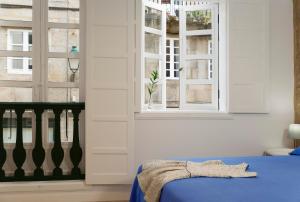 Cama o camas de una habitación en Pensión Rua Nova