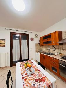 a kitchen with a table with a plate of food on it at Elisabeth home in Modica