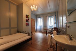 Postel nebo postele na pokoji v ubytování Hotel Restaurant Schwert Thun