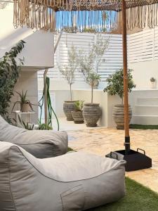 a room filled with lots of potted plants at Myronos suite with jacuzzi in Piraeus