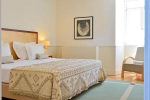 Cama ou camas em um quarto em Pousada da Serra da Estrela