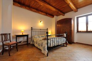 a bedroom with a bed and a table and a window at AgriResidence L'Antica Fattoria - sul Lago in Bolsena +54 photos