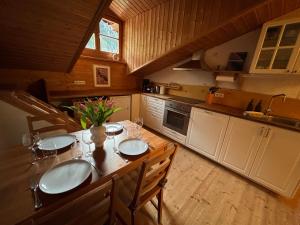 a kitchen with a table with two sinks in it at Hörndlhof in Abtenau +85 photos
