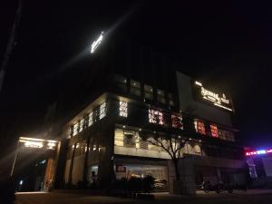 a building at night with its lights on at Hotel Shubham Prestige RC Puram in Lingampalli
