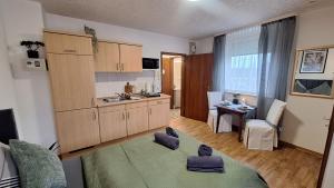 a kitchen with purple stepping stools in a room at Gästehaus Mittmann in Bad Kissingen